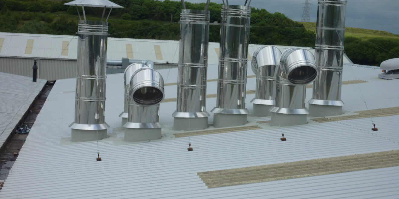 Roof upstands and access hatches on top of a white roof